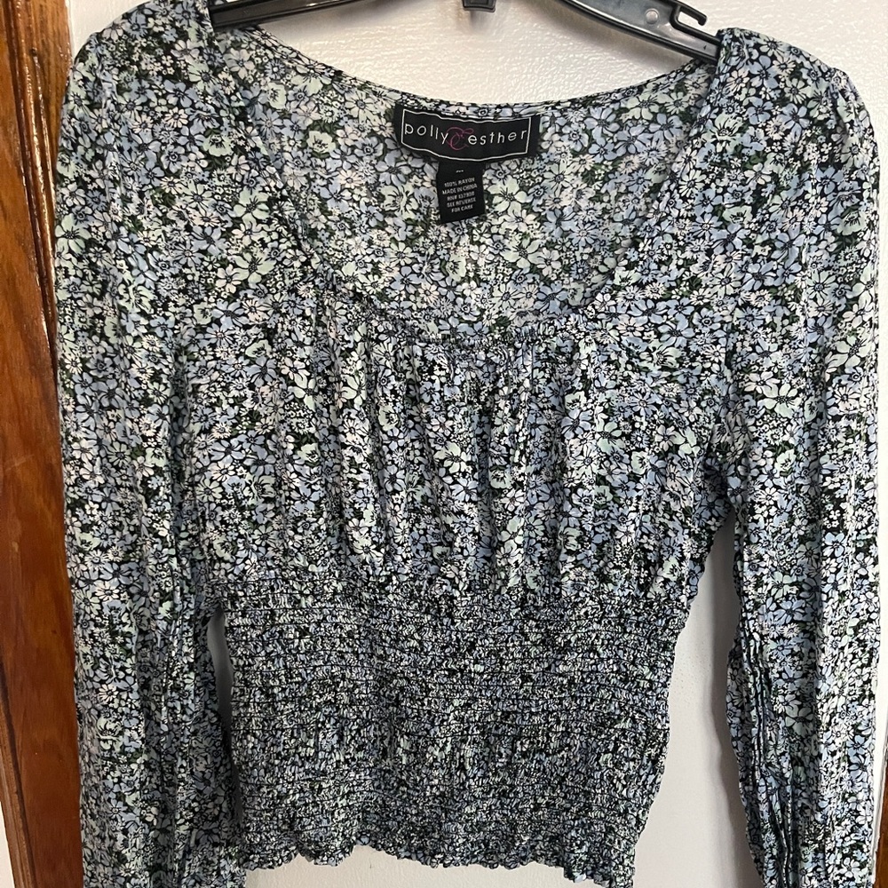 Medium sized blue floral peplum blouse top.